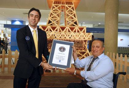 Toufic&nbsp;Daher&nbsp;unveils&nbsp;his&nbsp;model&nbsp;of&nbsp;the&nbsp;Eiffel&nbsp;Tower&nbsp;and&nbsp;presents&nbsp;with&nbsp;a&nbsp;certificate&nbsp;of&nbsp;Guinness&nbsp;World&nbsp;Records&nbsp;at&nbsp;the&nbsp;City&nbsp;Mall&nbsp;in&nbsp;Beirut&nbsp;on&nbsp;Nov.&nbsp;11&nbsp;2009.&nbsp;It&nbsp;took&nbsp;Wheelchair-bound&nbsp;Lebanese&nbsp;craftsman&nbsp;Tofic&nbsp;Daher&nbsp;2,316&nbsp;hours&nbsp;of&nbsp;work&nbsp;and&nbsp;11,000&nbsp;dollars&nbsp;to&nbsp;build&nbsp;the&nbsp;6.53&nbsp;meter&nbsp;tower&nbsp;with&nbsp;a&nbsp;base&nbsp;of&nbsp;190?90&nbsp;cm,&nbsp;made&nbsp;of&nbsp;six&nbsp;million&nbsp;matchsticks,&nbsp;6,240&nbsp;tiny&nbsp;lamps&nbsp;and&nbsp;23&nbsp;flasher&nbsp;lamps.(Xinhua/AFP&nbsp;Photo)