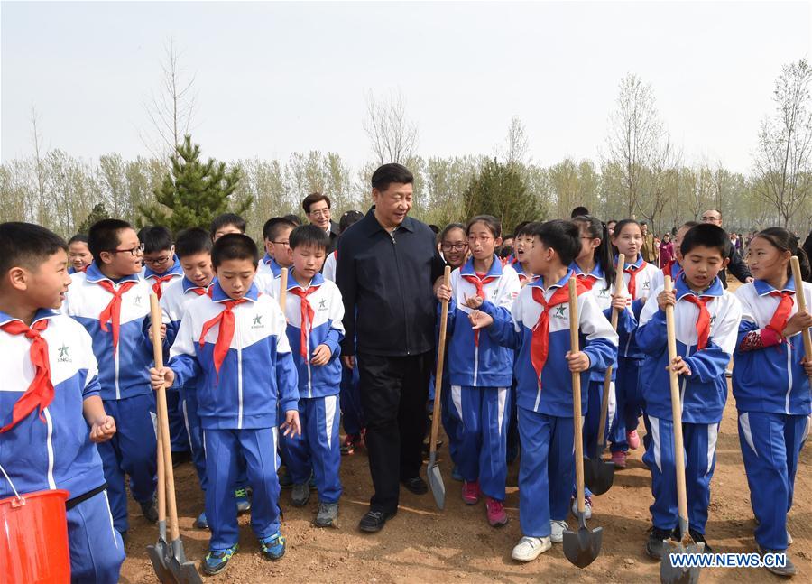 Chinese President Xi Jinping (C) walks with pupils after a tree-planting event in Xihongmen Township of Daxing District in Beijing, capital of China, April 5, 2016. Top leaders Xi Jinping, Li Keqiang, Zhang Dejiang, Yu Zhengsheng, Liu Yunshan, Wang Qishan and Zhang Gaoli attended a voluntary tree-planting in Beijing on Tuesday. (Xinhua/Li Xueren)