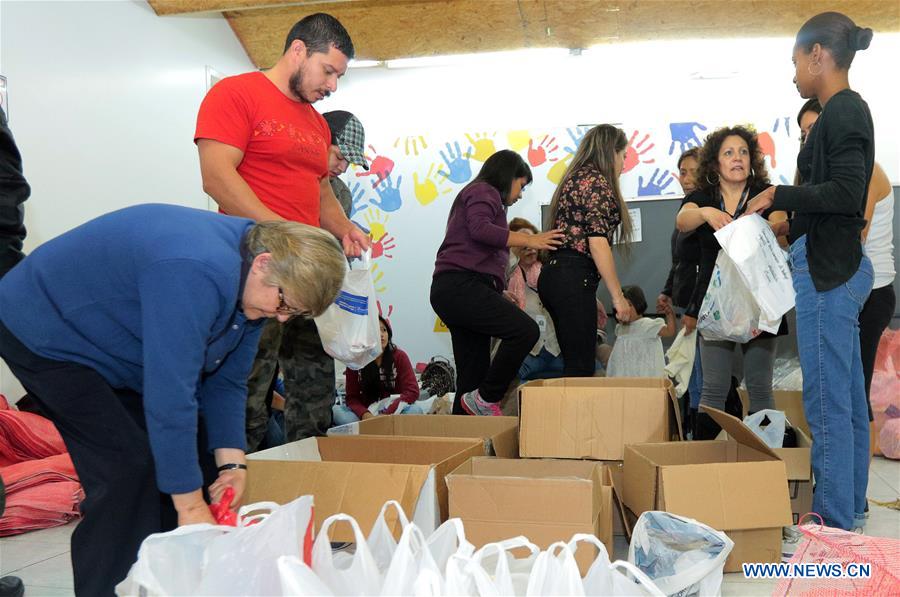 QUITO, April 18, 2016 (Xinhua) -- Image provided by Public News Agency of Ecuador and South America ANDES shows people organizing relief supplies to be transported to the affected areas by the earthquake in a collecion center installed at the Ministry of Economic and Social Inclusion (MIES, for its acronym in Spanish), in the city of Quito, Ecuador, on April 18, 2016. Rescue teams in Ecuador intensified efforts on Monday to rescue people and find bodies trapped in the rubble caused by Saturday night
