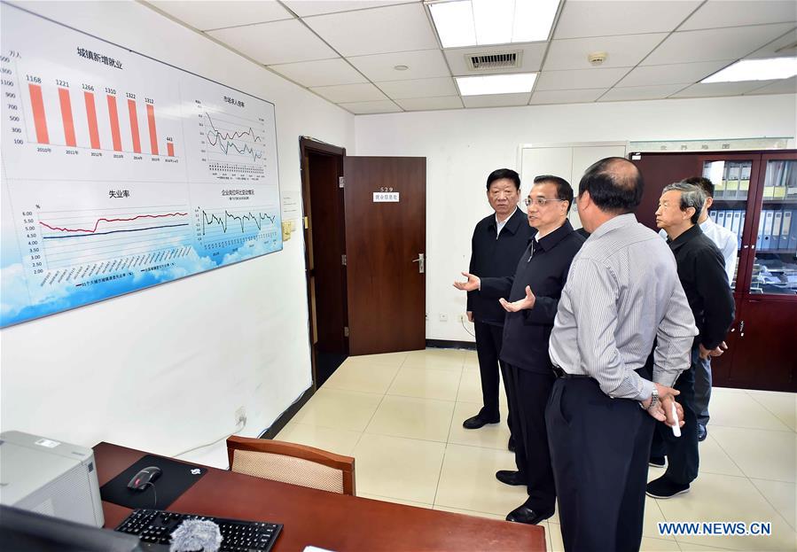 Chinese Premier Li Keqiang (2nd L) visits the Ministry of Human Resources and Social Security in Beijing, capital of China, May 6, 2016. Li Keqiang inspected the Ministry of Human Resources and Social Security on May 6, urging for more efforts to support employment to guard against large-scale unemployment. (Xinhua/Li Tao)