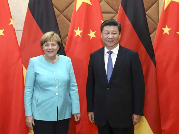 BEIJING, June 13, 2016 (Xinhua) -- Chinese President Xi Jinping (R) meets with German Chancellor Angela Merkel in Beijing, capital of China, June 13, 2016. (Xinhua/Pang Xinglei)