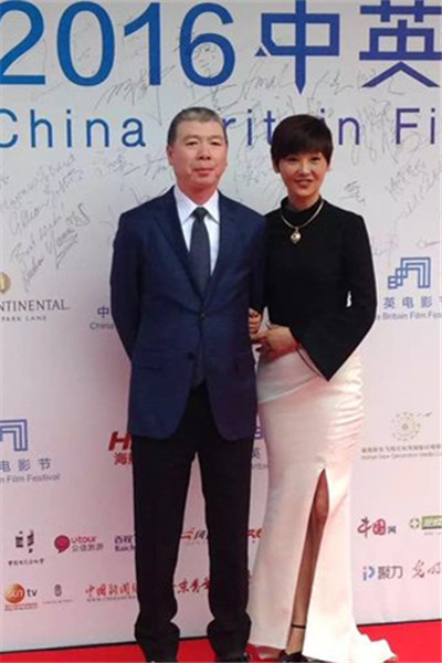 Film director Feng Xiaogang and his wife Xu Fan.