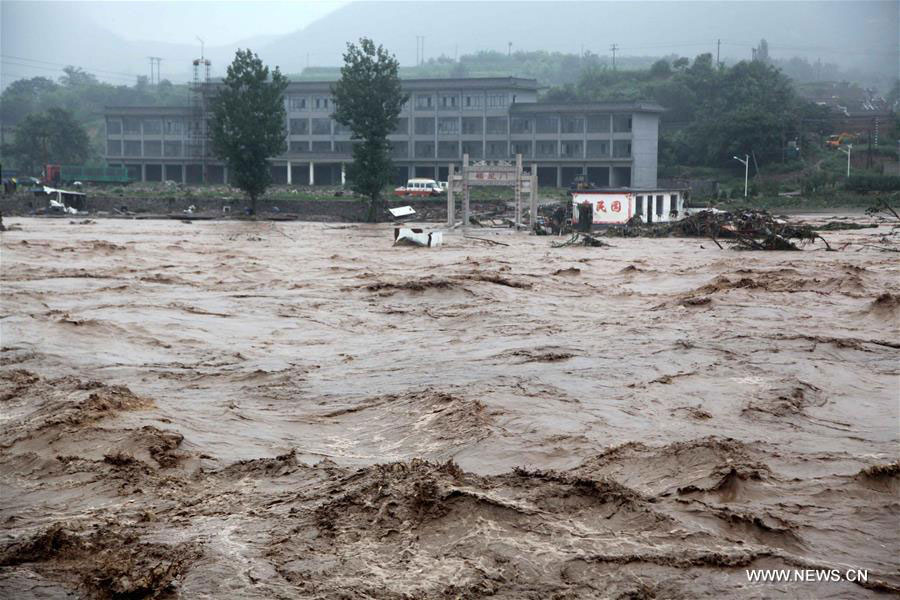 Photo taken on July 20, 2016 shows floods in Jingxing County of Shijiazhuang City, north China
