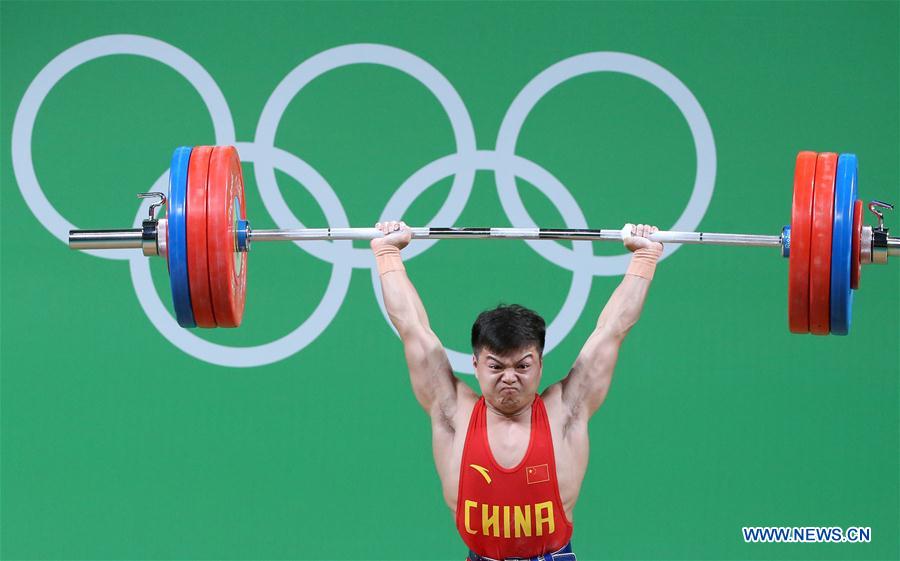 Long Qingquan of China competes during the men