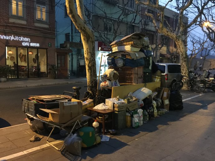 Cui Hengyi was on downtown Anfu Road as he has been everyday for the past decade. The garbage collector says he has helped some 3,000 stray dogs and cats