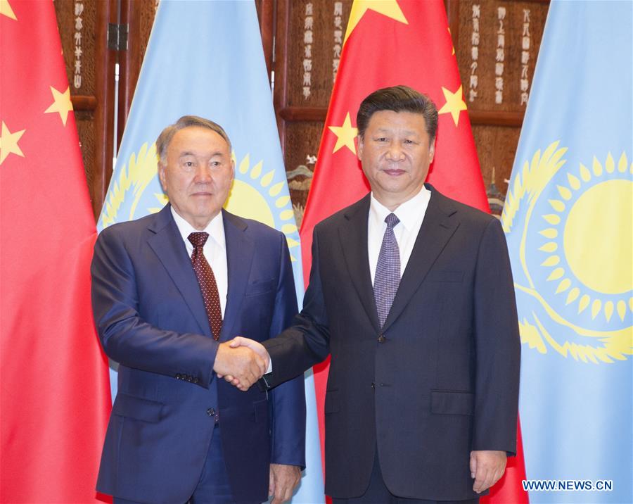 Chinese President Xi Jinping (R) holds talks with his Kazakh counterpart Nursultan Nazarbayev in Hangzhou, capital city of east China