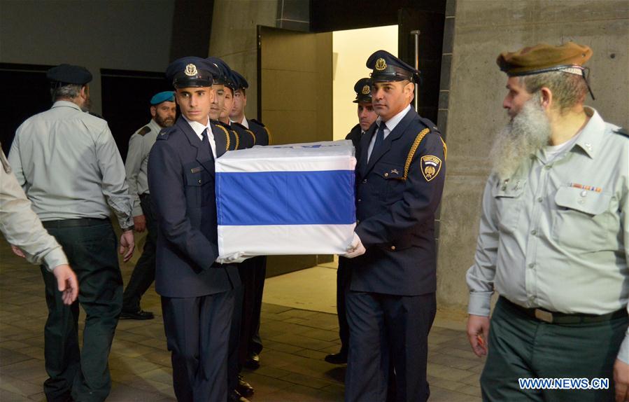 The coffin of former Israeli President Shimon Peres is carried to a special army vehicle as it is transferred from Tzrifim army base to Jerusalem, Sept. 29, 2016. Israel