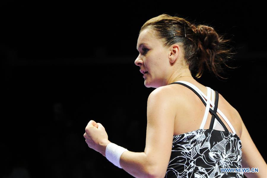 Agnieszka Radwanska of Poland reacts during the WTA Finals round robin match against Garbine Muguruza of Spain at Singapore Indoor Stadium, Oct. 26, 2016. Radwanska won 2-0. (Xinhua/Then Chih Wey) 