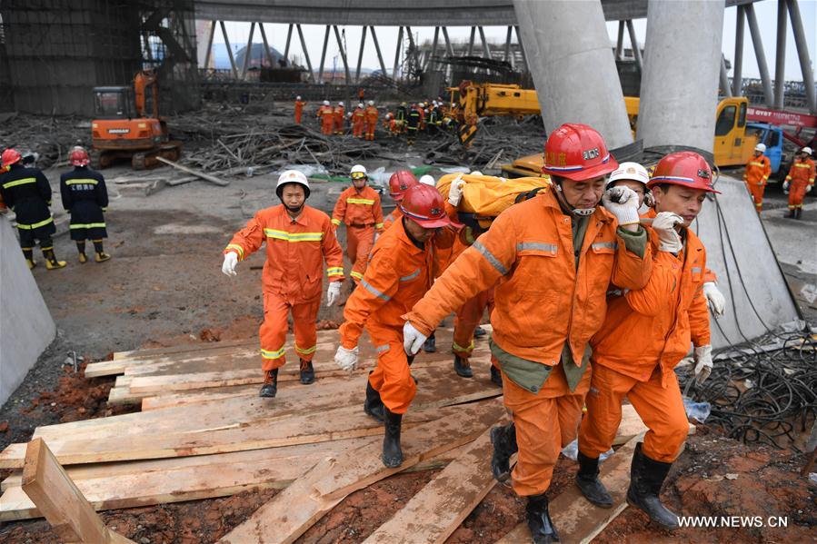 Rescuers work at the accident site at the Fengcheng power plant in Yichun City, east China