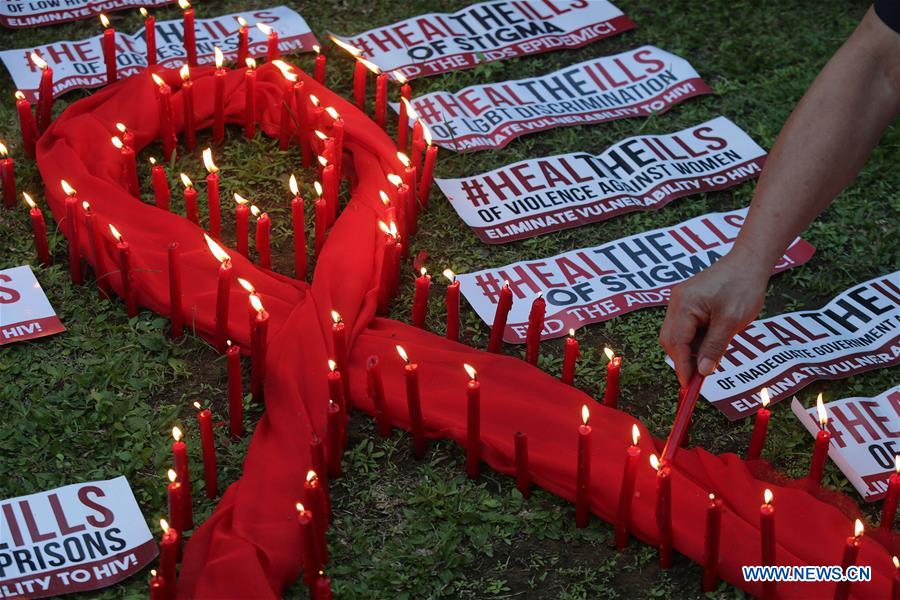 vigils and red ribbons marked global awareness of