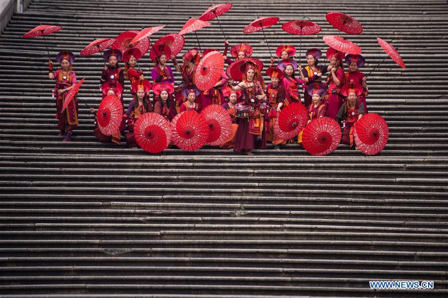 Actresses take part in the "Parade through Macao, Latin City" in Macao, south China, Dec. 4, 2016. The parade was held here on Sunday to mark the 17th anniversary of Macao