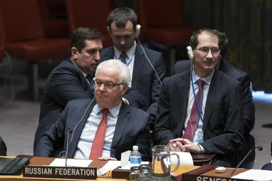 Vitaly Churkin(front), Russian permanent representative to the United Nations, is pictured after the Security Council adopted a resolution endorsing the Syria cease-fire arrangement brokered by Russia and Turkey as well as the new peace talks plan among Syrian conflict parties at the UN headquarters in New York, Dec. 31, 2016. The UN Security Council on Saturday unanimously adopted a resolution supporting the Syria cease-fire arrangement brokered by Russia and Turkey as well as a new peace talks plan among Syrian conflict parties. (Xinhua/Li Muzi)