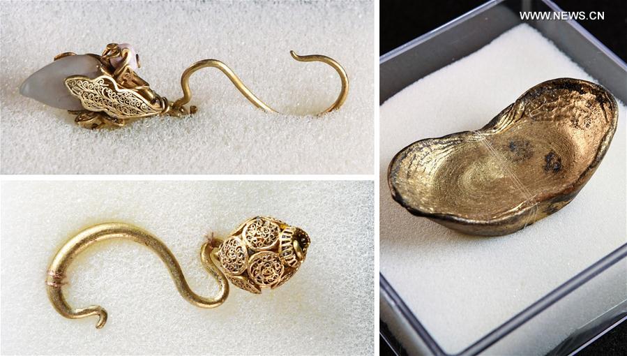 Como photo taken on March 19, 2017 shows golden ingot and jewelleries unearthed during an archaeological excavation at Pengshan District in Meishan City, southwest China