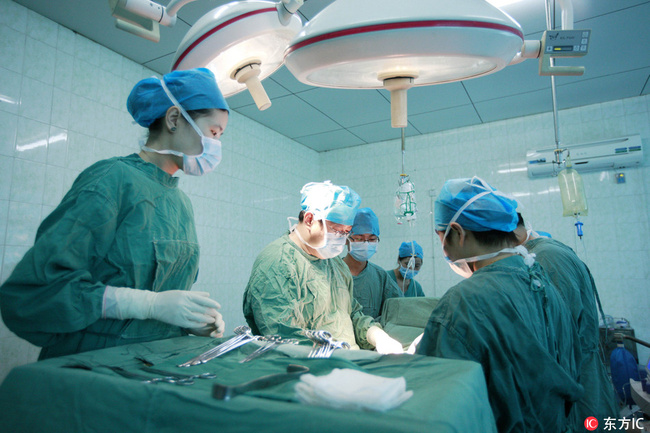 Undated photo shows doctors and nurses conducting an organ transplant surgery. 