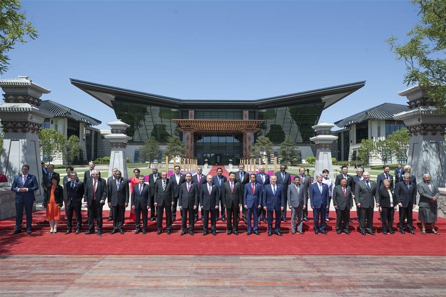 Chinese President Xi Jinping, foreign delegation heads and guests pose for a group photo at the Leaders