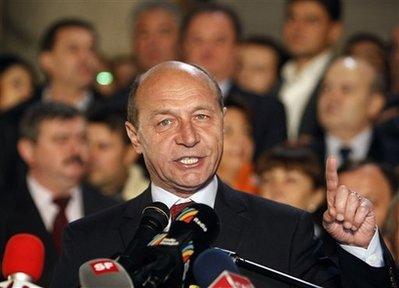 Romania's&nbsp;President&nbsp;in&nbsp;office,&nbsp;Traian&nbsp;Basescu,&nbsp;gestures&nbsp;during&nbsp;a&nbsp;speech&nbsp;after&nbsp;exit&nbsp;polls&nbsp;were&nbsp;released&nbsp;in&nbsp;Bucharest,&nbsp;Romania,&nbsp;Sunday&nbsp;Nov.&nbsp;22,&nbsp;2009.&nbsp;Romania&nbsp;held&nbsp;presidential&nbsp;elections,&nbsp;the&nbsp;first&nbsp;since&nbsp;the&nbsp;country&nbsp;joined&nbsp;the&nbsp;European&nbsp;Union&nbsp;in&nbsp;2007.&nbsp;According&nbsp;to&nbsp;exit&nbsp;polls&nbsp;Basescu&nbsp;leads&nbsp;after&nbsp;the&nbsp;first&nbsp;round&nbsp;followed&nbsp;by&nbsp;the&nbsp;Social&nbsp;Democracy&nbsp;Party&nbsp;candidate&nbsp;Mircea&nbsp;Geoana.&nbsp;An&nbsp;election&nbsp;runoff&nbsp;will&nbsp;be&nbsp;held&nbsp;on&nbsp;Dec.&nbsp;6.(AP&nbsp;Photo/Vadim&nbsp;Ghirda)&nbsp;