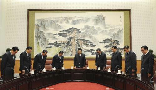 Chinese top leaders Hu Jintao (C), Wu Bangguo (4th R), Wen Jiabao (4th L), Jia Qinglin (3rd R), Li Changchun (3rd L), Xi Jinping (2nd R), Li Keqiang (2nd L), He Guoqiang (1st R) and Zhou Yongkang (1st L), mourn for the victims of Yushu earthquake, during the start of the meeting of the Standing Committee members of the Political Bureau of the Communist Party of China Central Committee, in Beijing, capital of China, April 21, 2010.(Xinhua/Li Xueren) 