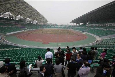Journalists&nbsp;tour&nbsp;the&nbsp;University&nbsp;Town&nbsp;Main&nbsp;Stadium&nbsp;for&nbsp;the&nbsp;2010&nbsp;Asian&nbsp;Games,&nbsp;in&nbsp;Guangzhou,&nbsp;in&nbsp;south&nbsp;China's&nbsp;Guangdong&nbsp;province&nbsp;Monday,&nbsp;Dec.&nbsp;14,&nbsp;2009.&nbsp;The&nbsp;stadium&nbsp;will&nbsp;host&nbsp;Rugby&nbsp;and&nbsp;Soccer&nbsp;competition&nbsp;at&nbsp;the&nbsp;16th&nbsp;Asian&nbsp;Games,&nbsp;which&nbsp;will&nbsp;be&nbsp;held&nbsp;in&nbsp;Guangzhou&nbsp;November&nbsp;12-27,&nbsp;2010.(AP&nbsp;Photo/Greg&nbsp;Baker)