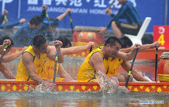 Participants compete in a dragon boat race in Wanning, a county in south China's Hainan Province, Feb. 22, 2012. Sixteen teams from all over the country took part in the China Long Zhou (dragon boat) Tournament 2012. (Xinhua/Guo Cheng)