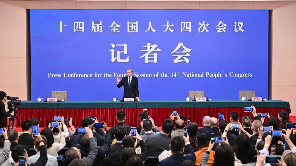 Chinese Foreign Minister Wang Yi, also a member of the Political Bureau of the Communist Party of China Central Committee, attends a press conference on China