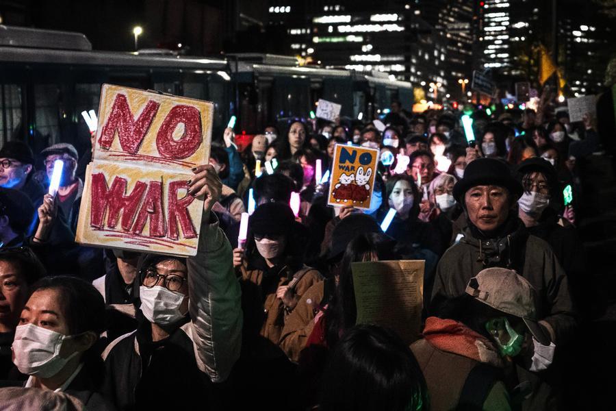 People participate in a protest outside the parliament building in Tokyo, Japan, April 8, 2026. (Xinhua/Jia Haocheng)
